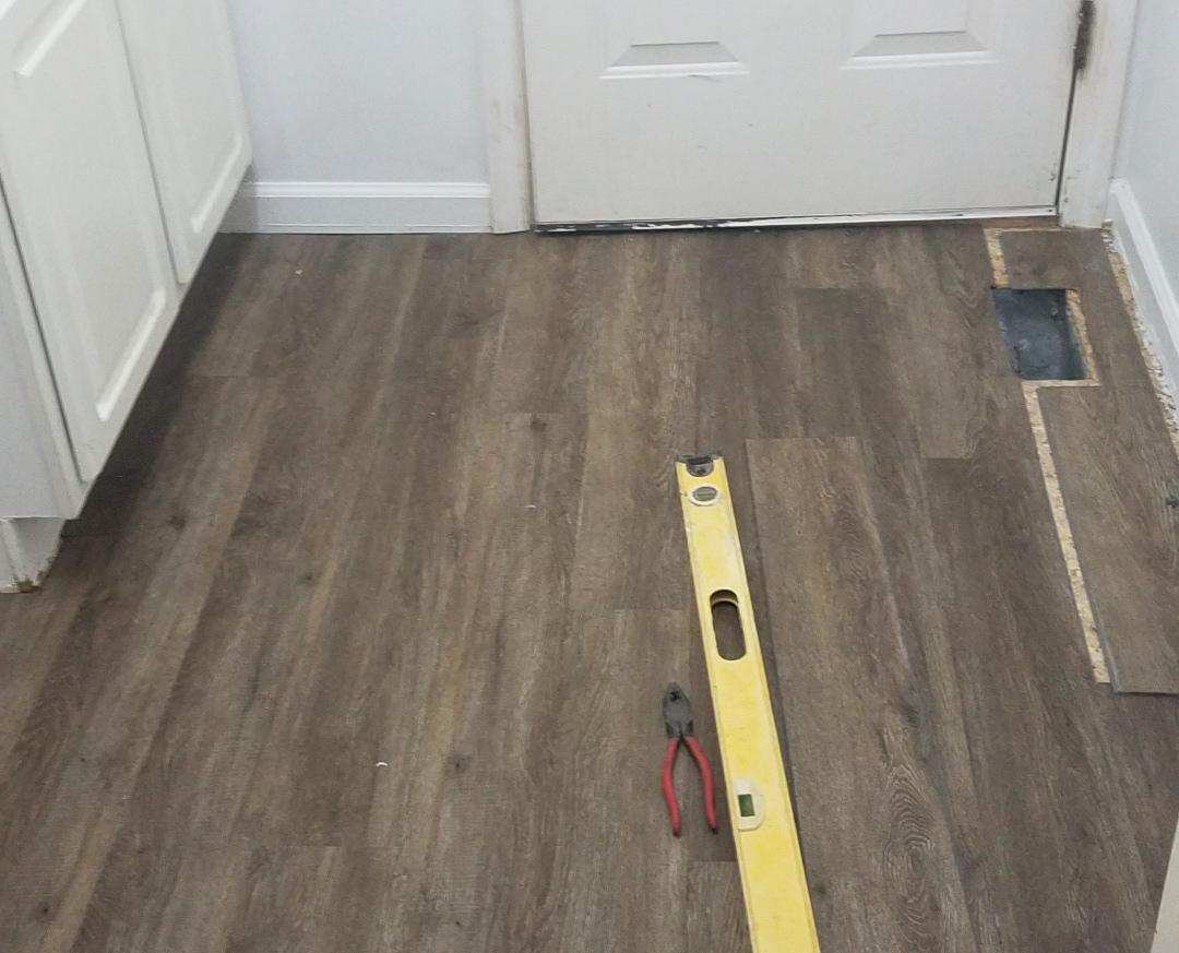 Photo of a floor in the process of being repaired